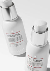 Two bottles of Red Serum on a white background