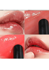 Close-up of glossy red lipstick on lips with a black applicator.