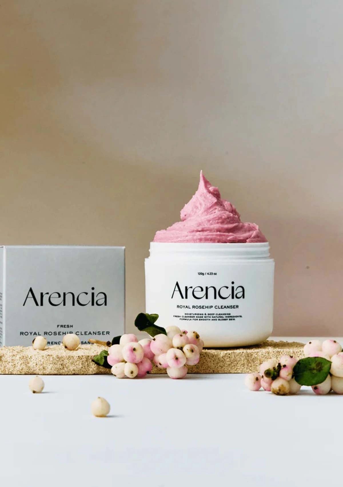 Arencia facial cleanser with pink cream on a neutral background