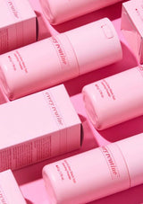Pink skincare bottles and boxes with 'every routine' branding on a pink background