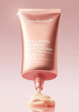 Pink tube of Medicube Collagen Firming Sun Cream on a pink background