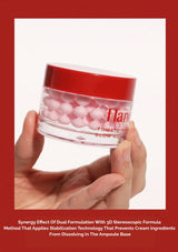 Hand holding a jar of Flanel product with a red lid against a white background