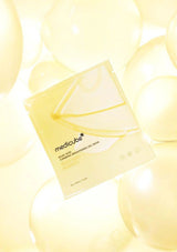 Medicube sheet mask packaging on a soft yellow background