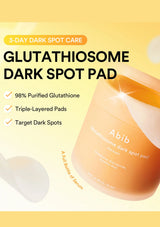 Glutathione Dark Spot Pad jar in a soft peach-orange color, shown alongside text highlighting '3-Day Dark Spot Care' and product benefits on a pale yellow background.