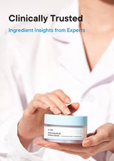 Person holding a skincare product with text about clinically trusted ingredient insights from experts.