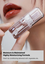 Lip balm held by a hand with a blurred background