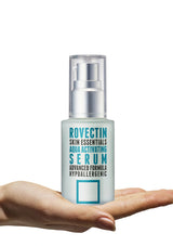 Rovectin serum bottle held in a hand on a white background