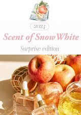 2024 'Scent of Snow White' perfume set with apples and a decorative napkin on a white background.