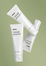 Three tubes of Bovectin Lotus Cream on a green background