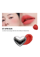 Lipstick with a heart-shaped cap on a white background, featuring a model wearing the lipstick.