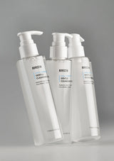 Three bottles of Ravecetin Gentle Cleansing Gel on a gray background