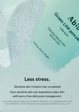 A close-up of a translucent, textured skincare pad labeled 'Green LHA pore pad' with water droplets, alongside a light blue tube. Below, text reads 'Less stress.
