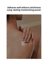 Person applying a moisturizing product to their shoulder with text highlighting its benefits.