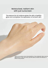 Hand with moisturized skin on a light background, showcasing the effect of sunscreen.