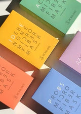Colorful boxes of microfiber masks with 'Be Balance' branding on a neutral background.