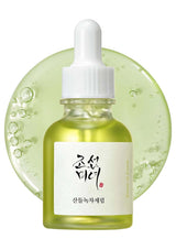 Skincare serum bottle with dropper on a white background