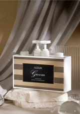 Decorative table setting with a card holder labeled 'Groom' on a draped background