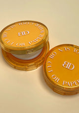 Two open containers of BD Sun Oil Cuticle Paper on a beige background