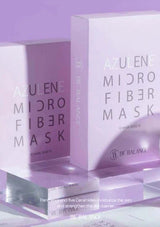 Be Balance Azulene Microfiber Mask packaging on a reflective surface with a purple gradient background