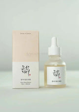 Korean skincare serum bottle and packaging on a light gray background