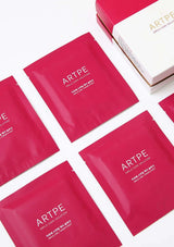 Red ARTPE skincare solution packets on a white background