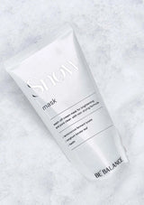 Skincare mask packaging on a textured white background