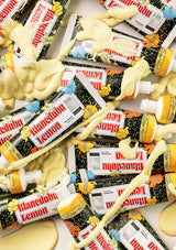 Blancheda Lemon candy bars with a thick layer of white cream on a white background