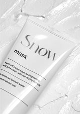 Snow mask packaging on a textured white background
