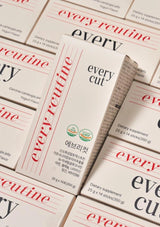 Multiple boxes of 'every cut' dietary supplements with visible branding.
