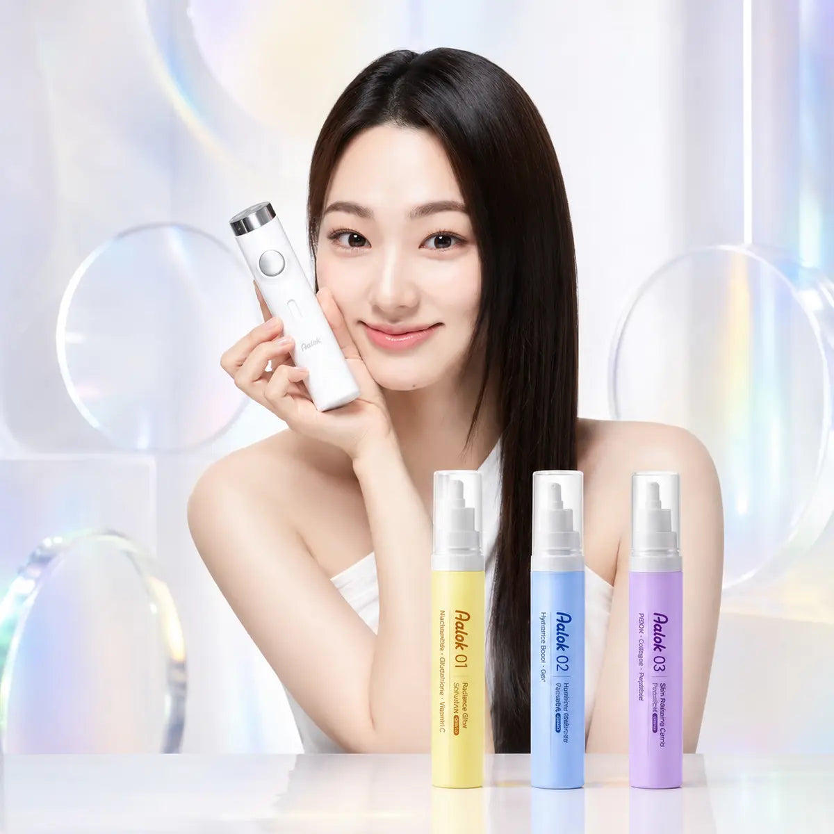 AALOK SkinMax skincare device with yellow, blue and purple serum cartridges and a model