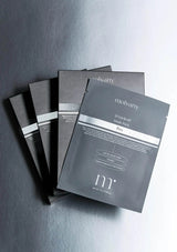 Molvany face mask packets on a gray background