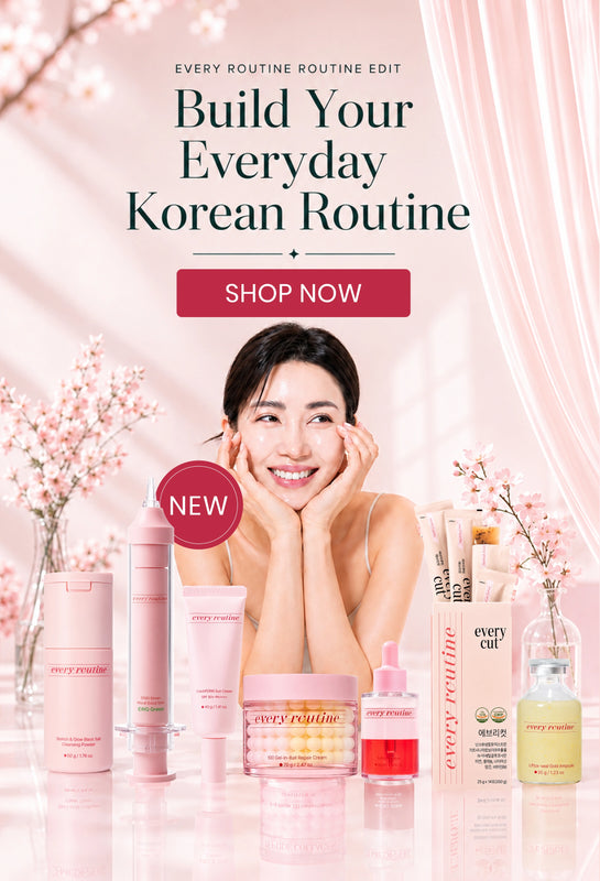 A promotional skincare ad with a smiling woman resting her head on her hands, surrounded by pink and clear cosmetic bottles and jars. Large text reads 'Build Your Everyday Korean Routine' with a 'SHOP NOW' button, and a pink 'NEW' badge appears over one product.