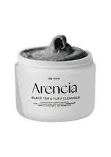 Arencia Black Tea & Yuzu Cleanser jar with gray cleanser on a white background
