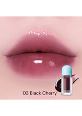 Lipstick with '03 Black Cherry' shade on a pink background