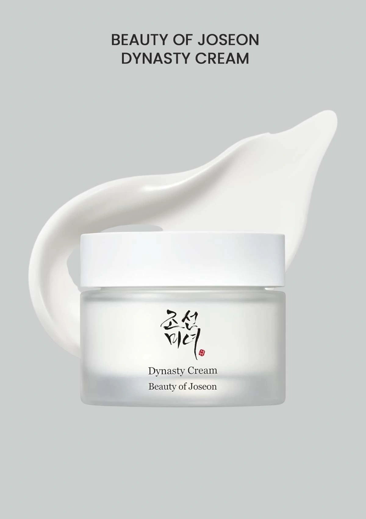 Beauty of Joseon Dynasty Cream jar with a white cream smear on a gray background