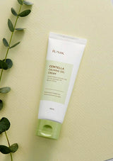 Tube of IUNIK Centella Calming Gel Cream on a light yellow background with green leaves.