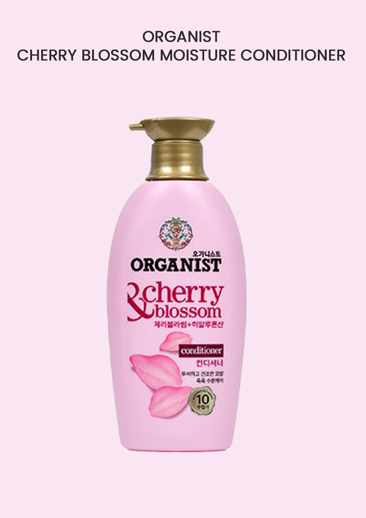 Pink bottle of Organist Cherry Blossom Moisture Conditioner on a light pink background