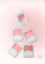 Set of blush products in light blue cases on a pink background