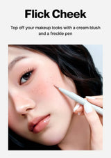 Makeup application with a cream blush and freckle pen on a model's face.