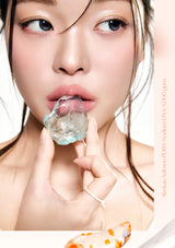Woman holding a piece of ice in her hand with a white background