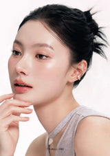 Woman with a soft expression on a white background