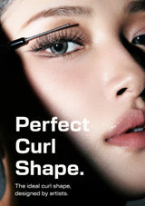 Close-up beauty advertisement showing a woman's face with mascara being applied near her eyebrow, with large white text reading 'Perfect Curl Shape.' and smaller text below.