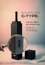 Aehb C-Type USB-C charging adapter with a transparent magnifying glass accessory and a small black cube, shown on a soft pink-to-blue gradient background with promotional text.