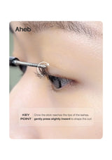 Close-up instructional photo of an eyelash curling tool being applied to a person's eyelashes, with text reading 'Aheb' and 'KEY POINT gently press slightly inward to shape the curl.'.