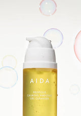 AIDA propolis calming ampoule gel cleanser bottle with bubbles in the background