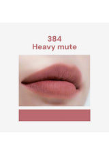 Lip color swatch labeled '384 Heavy Mute' on a white background