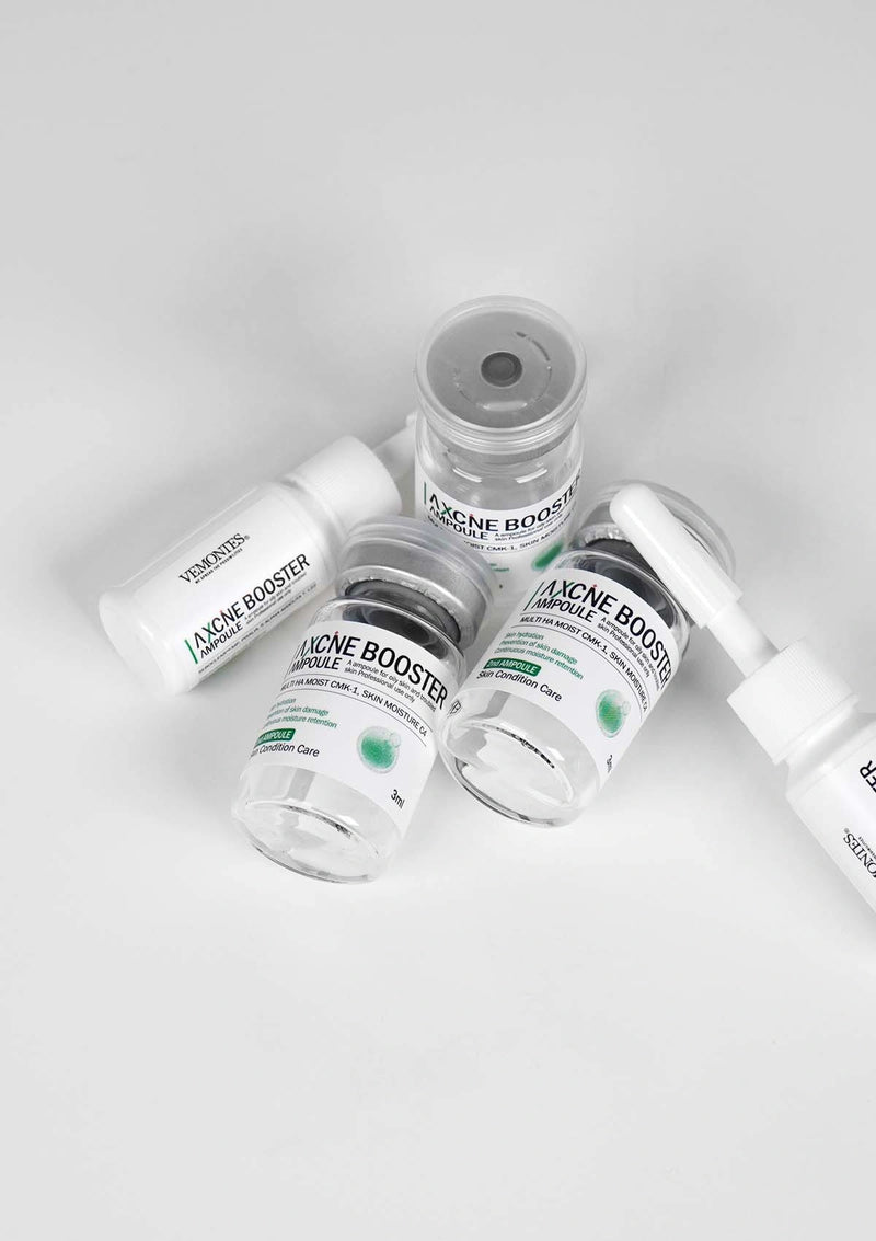 Acne booster product bottles on a white background