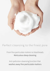 Hands holding a white cleansing pad with text about deep cleaning and anti-pollution function.