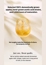 Glass of apple cider vinegar with ice on a light background, text about quality and craftsmanship.