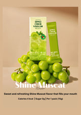 Green apple cider vinegar packets with grapes on a beige background